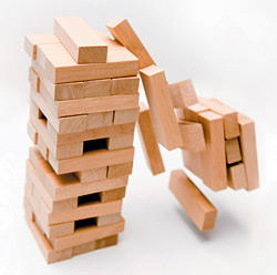 toppling jenga - Copyright – Stock Photo / Register Mark